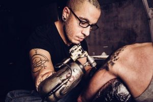 JC Sheitan Tenet tattooing 