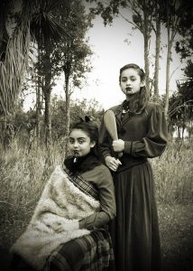 Two Maori girls with chin mocks