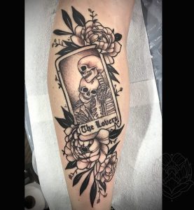 Skull & flower tattoo