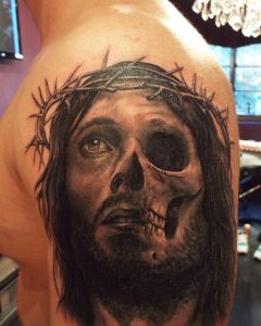 Half Jesus half skull tattoo