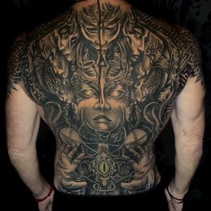 full dark realism backpiece tattoo