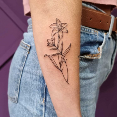 15 Dainty and Subtle Flower  Twig Tattoos by Lara Maju  Minimalist tattoo  Inner wrist tattoos Calla lily tattoos